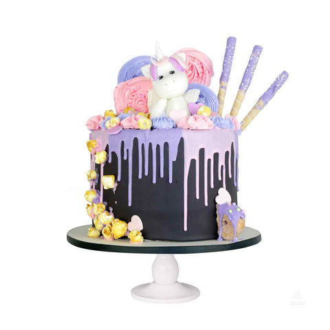 Unicorn Drip Cake, pastel con drip de colores y una figura de unicornio de fondant 3D